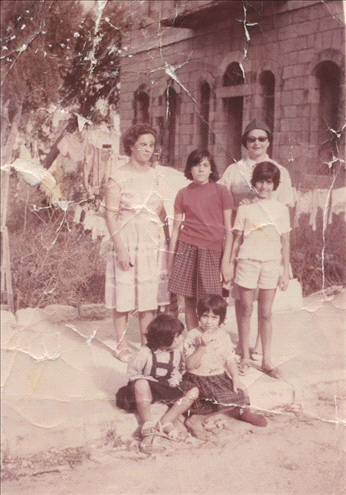 Musrara friends take a photo with a tourist in Ha'Ayin Chet St., Musrara 1965